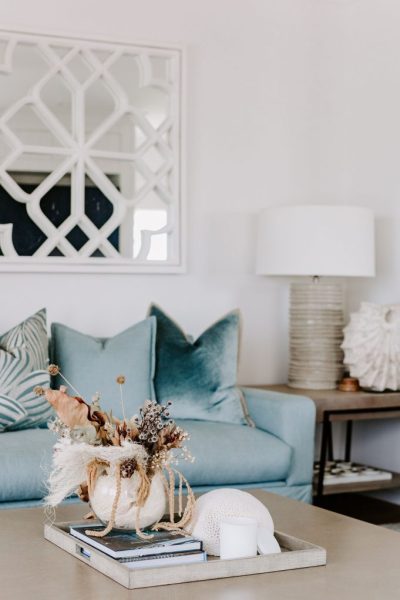 Caloundra unit renovation featuring coastal blue and white living room by sunshine coast designer and builder Coco Interiors
