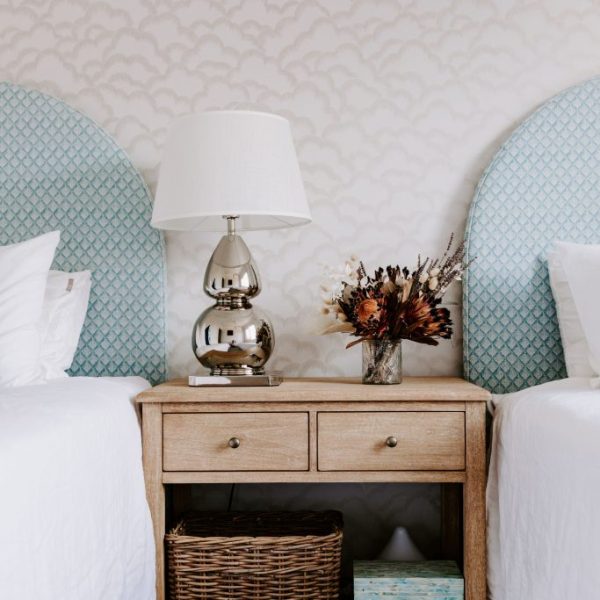 Noosa unit renovation featuring coastal blue and white bedroom by sunshine coast designer and builder