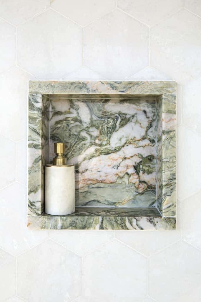 Home renovation builder sunshine coast featuring green marble in a shower niche